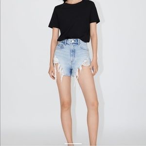 High waisted, distressed shorts